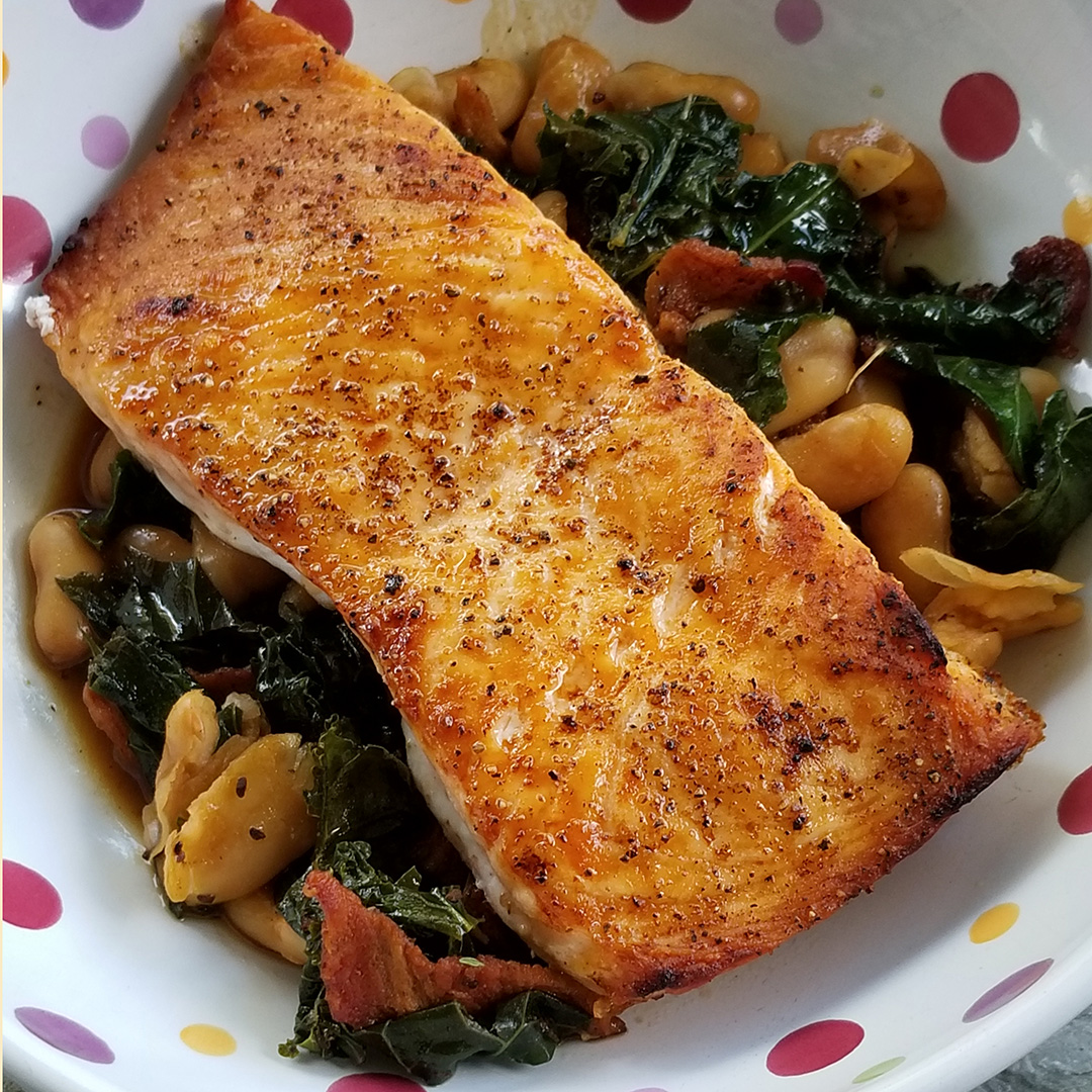 Broiled Salmon with a Cannelini Bean, Kale & Bacon Ragoût