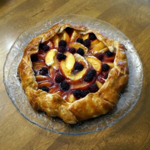 fresh peach and blackberry galette with dark rum