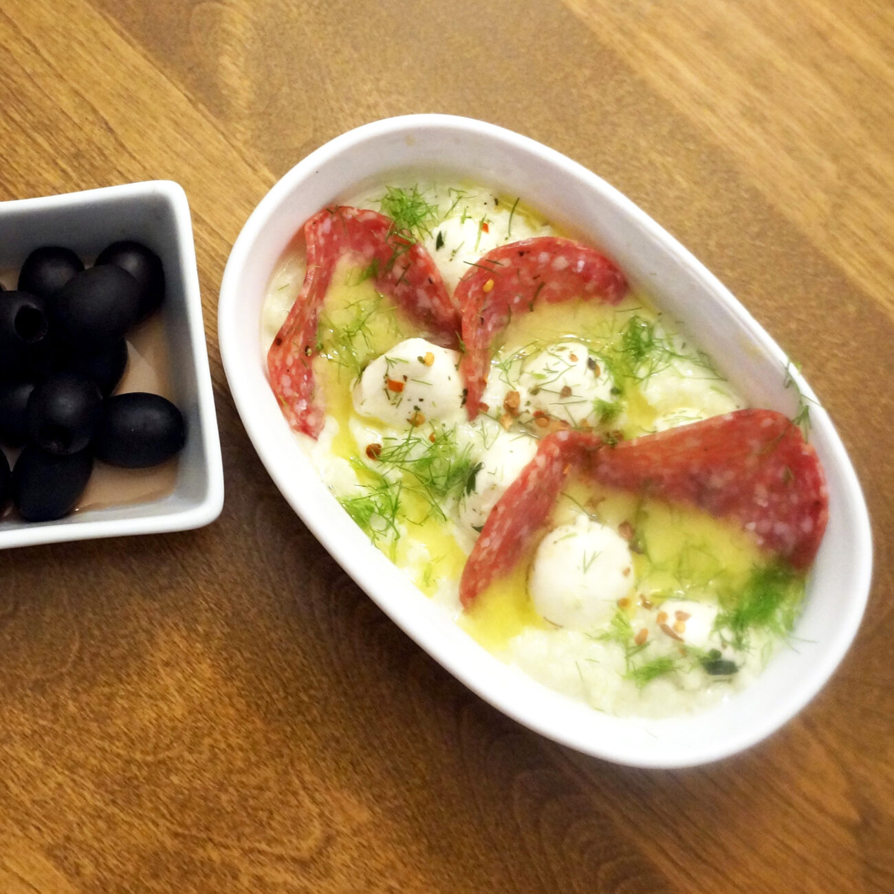 Baby buffalo mozzarella with fennel puree and salami with olives